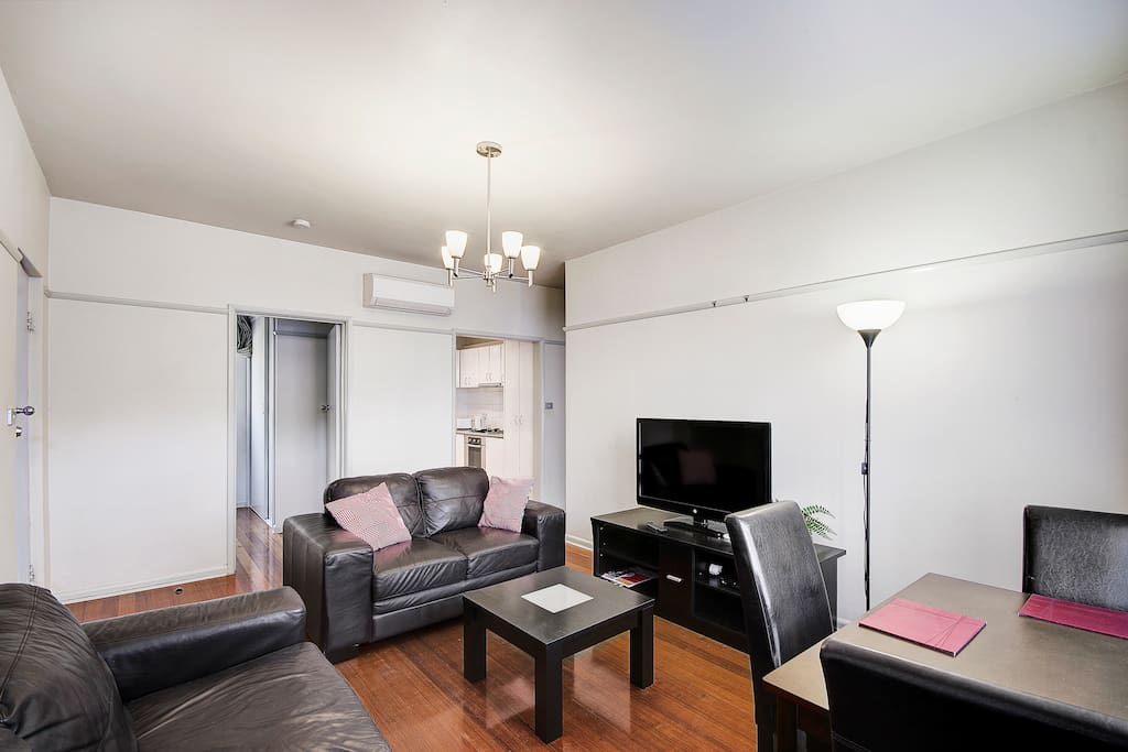 The lounge has quality furniture and the Galley kitchen to the right, bedroom 2 is the other door.