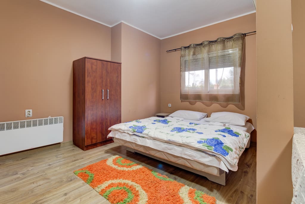 Warm tones are chosen to make our guests feel safe and create home-like atmosphere. AC in the bedroom corner can be adjusted to warm up or chill the space.