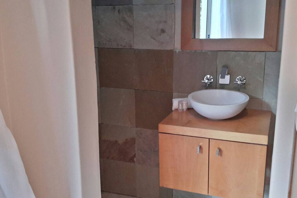 Bathroom, left is the shower and right is the toilet with Gebirit cistern and heated towel rail