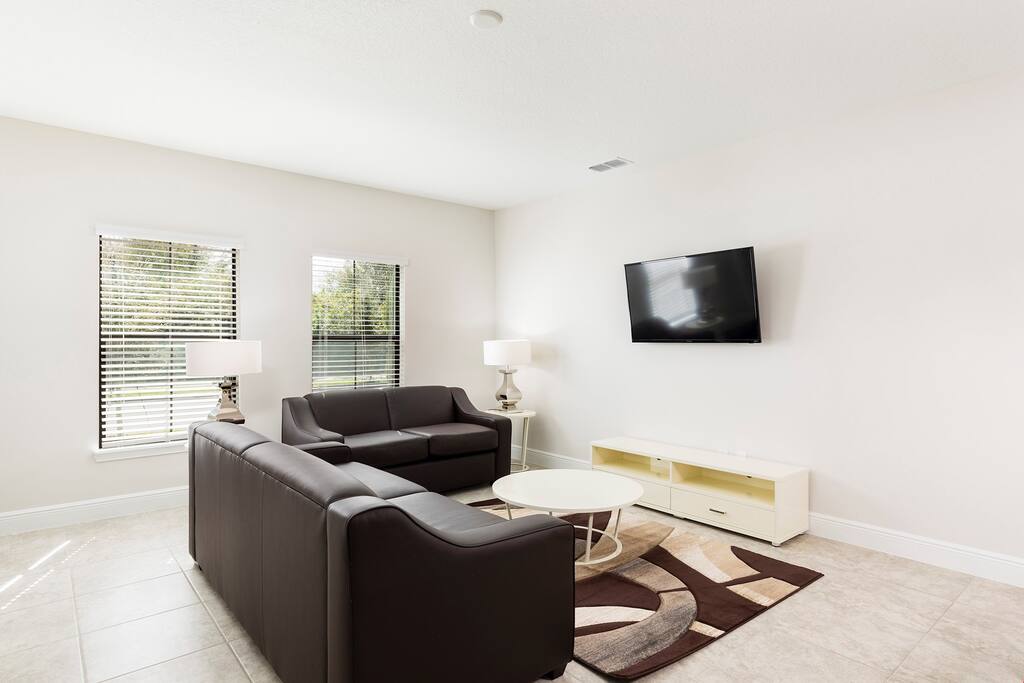 Relax in the cozy living room and catch a movie on the flatscreen TV.