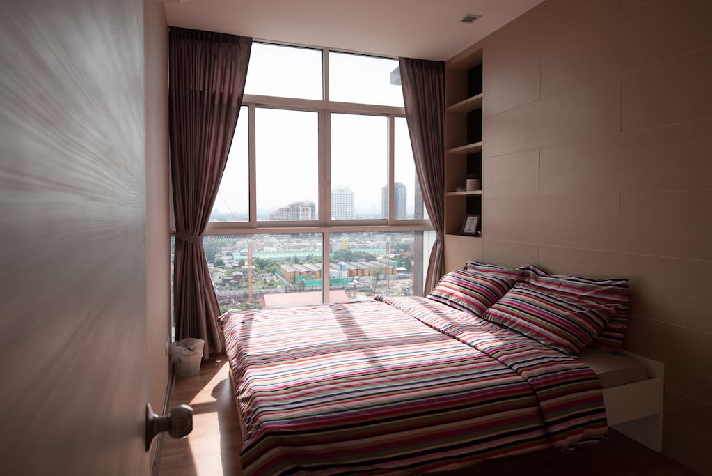 This is the smaller of the 2 bedrooms. As you can see, the window is huge with a nice view. You also get your own separate clothes closet which is on the right of the photo.