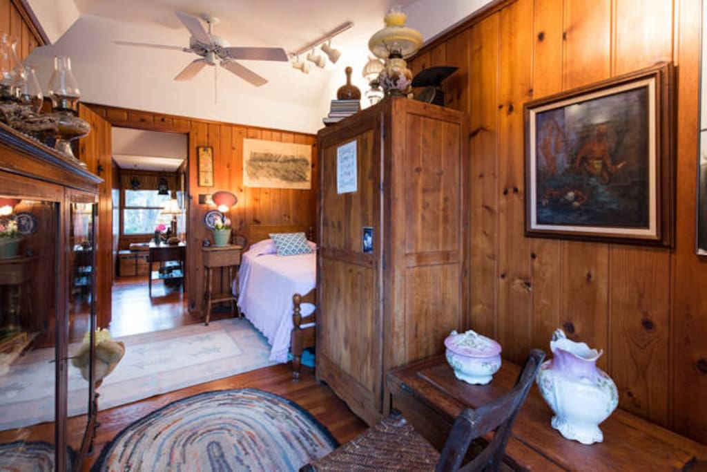 Great room with ceiling fan and antiques/full bathroom downstairs one floor