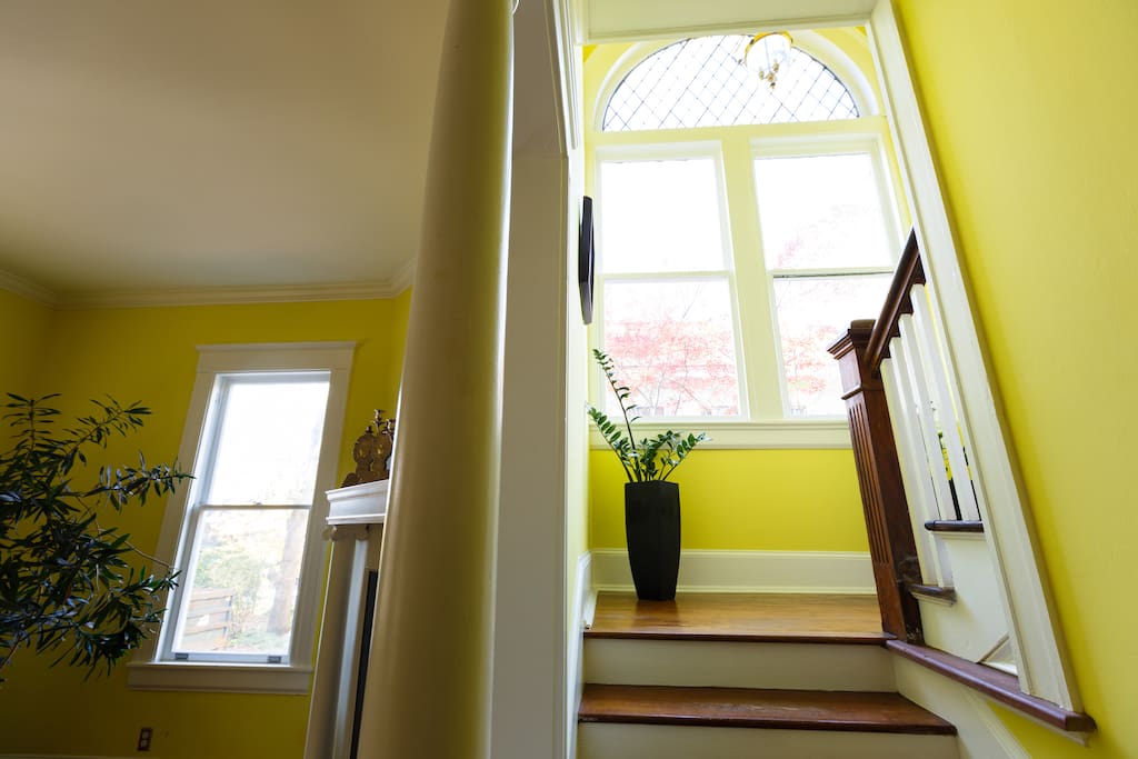Front staircase with original Victorian windows.