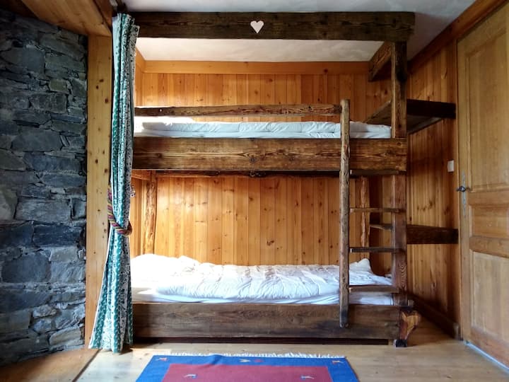 Chalet farm Tannery second floor independent  room N°4 with its bunk bed typical of old mountain farms and a single bed. 3 beds in total with shower en suite