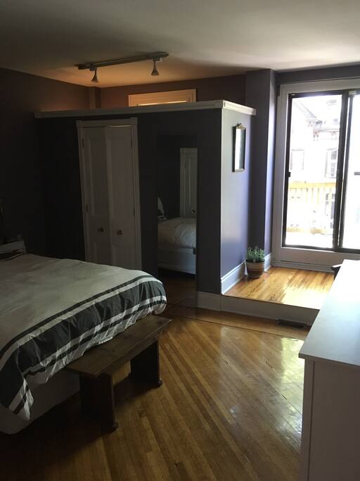 Second floor bedroom with balcony and washroom. Washroom has stand up shower