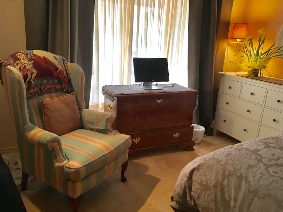 large bright bedroom with queen size bed
