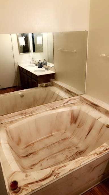 Master Bathroom (marble tile jacuzzi bathtub, dual sink, & toilet room)