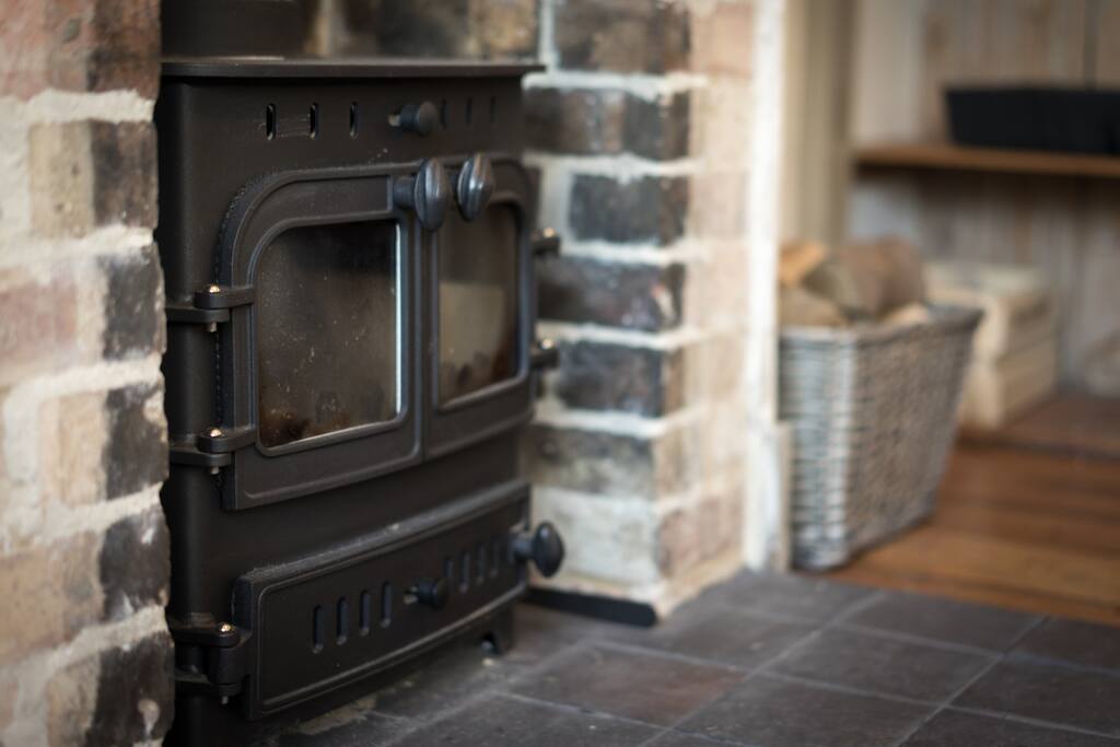 The wood burner really throws out some heat - we'll leave you a basket of logs, and you can buy more from the shop opposite the house.