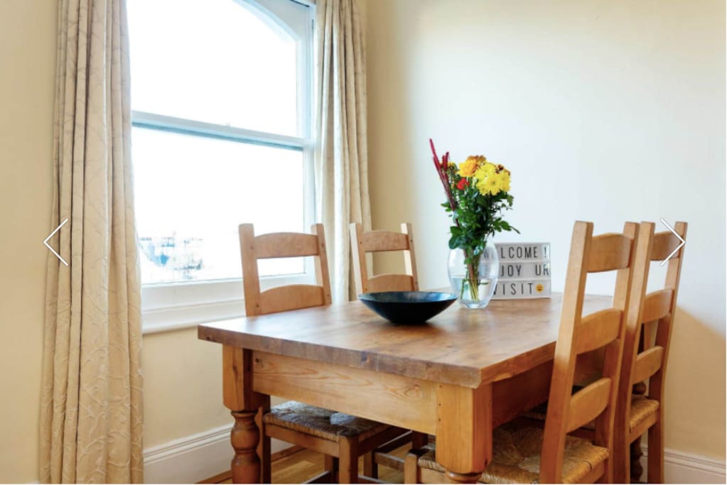 Living room and dining table, with lots of light