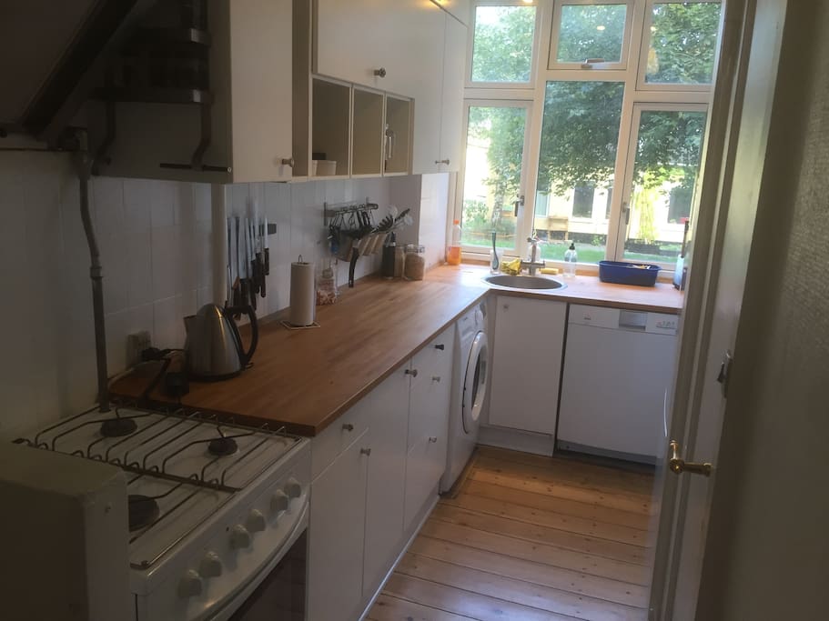 Spacious kitchen with room for two masterchefs at once. + Washing machine and dishwasher