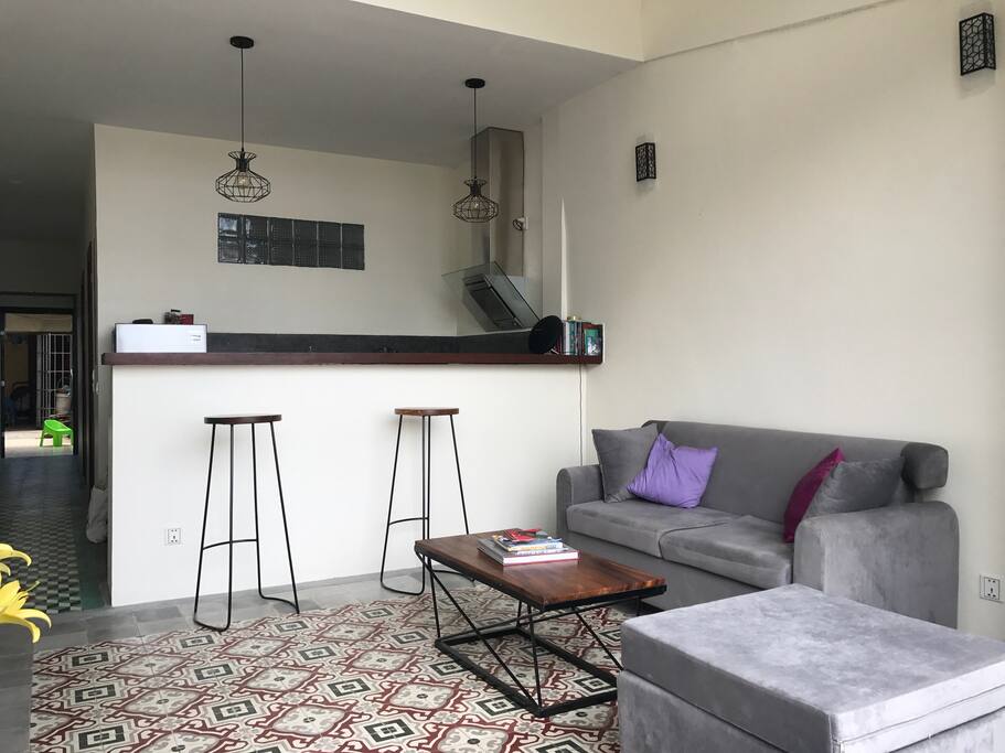 Living room, stools bar and kitchen