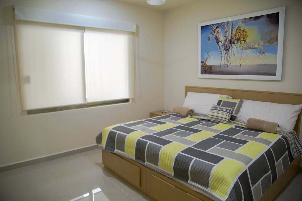 Second room with a king size bed with Italian design.
