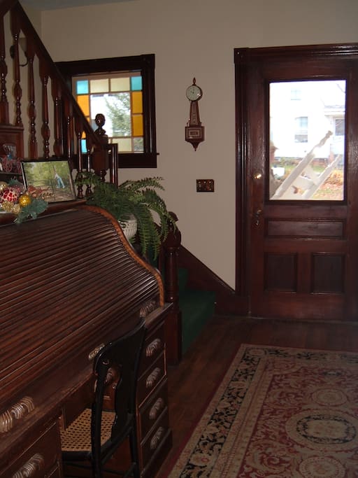 As you enter the front foyer, there'll be a place to hang your coats and see up to the 2nd floor landing through the open staircase.