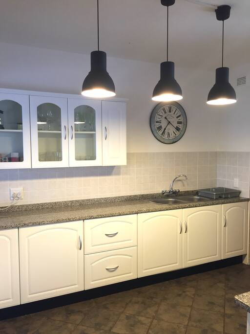 Open plan kitchen is fully equipped with laundry and dishwasher