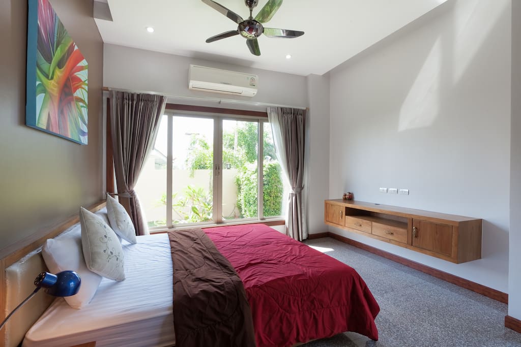 Large bedroom with ensuite shower opening on to the garden