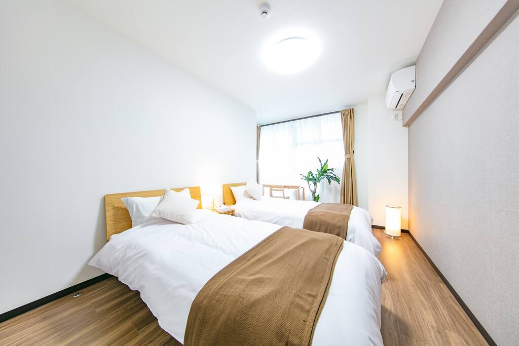 Two rooms, both with two beds, and an AC.