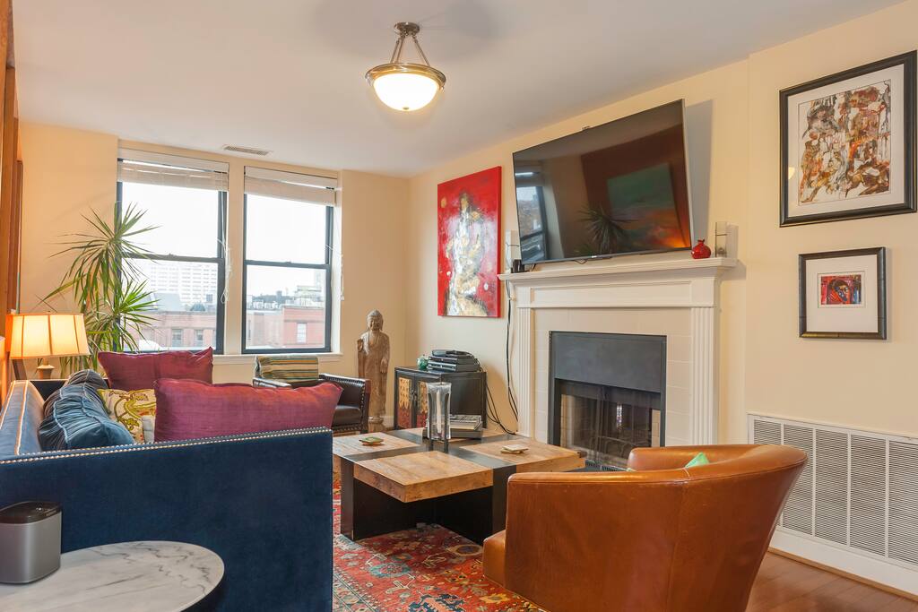 Bright and open living room with all the technology you need for a great night in. Enjoy endless premium movie channels on a new 65" Flat Screen.