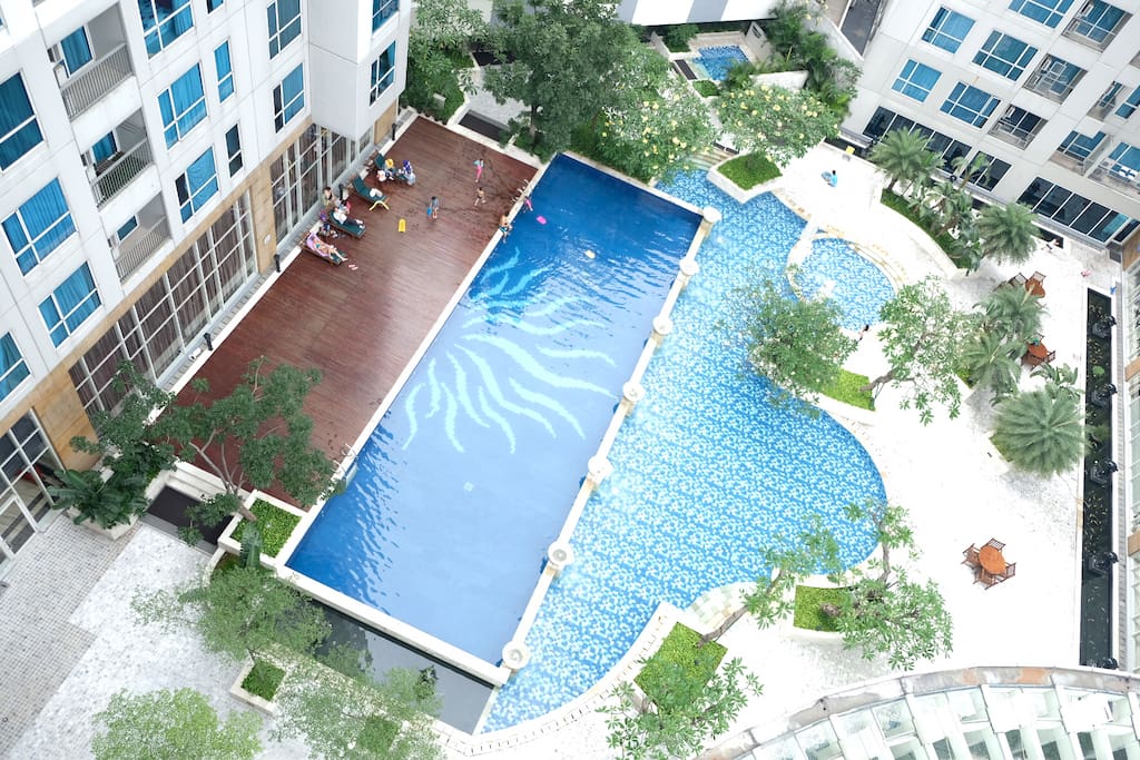 Swimming pool for adults and kids. Jacuzzi. (View from apartment window)