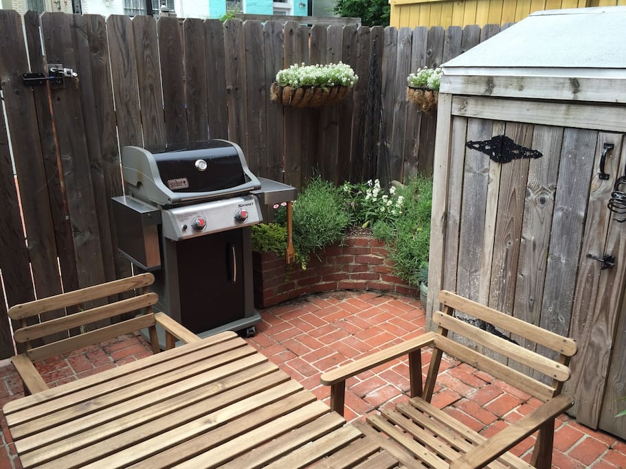 The serene, private patio has seating for four and a Weber grill.