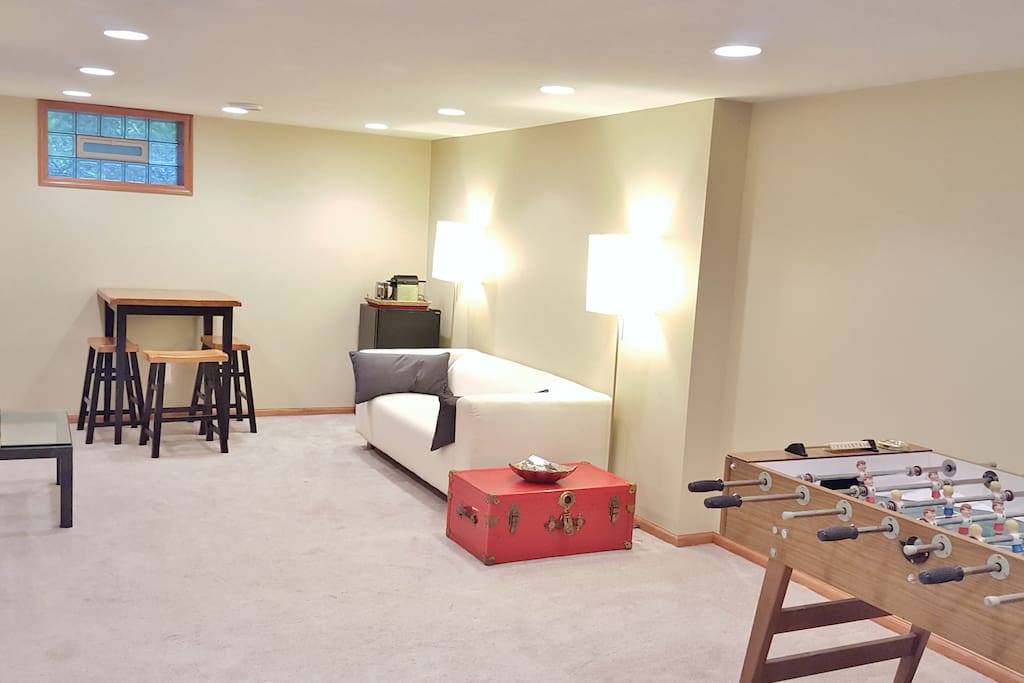 Comfy private suite with mini fridge, espresso maker, large-screen TV, Foosball, lightning-speed WiFi, and shower spa bathroom.