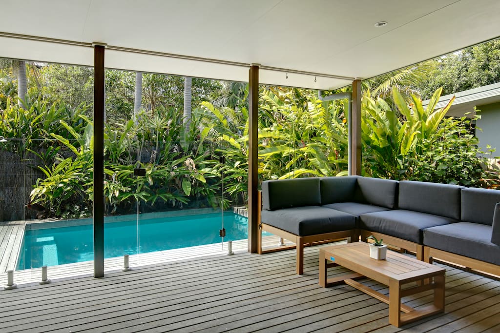 Living room opens onto pool deck