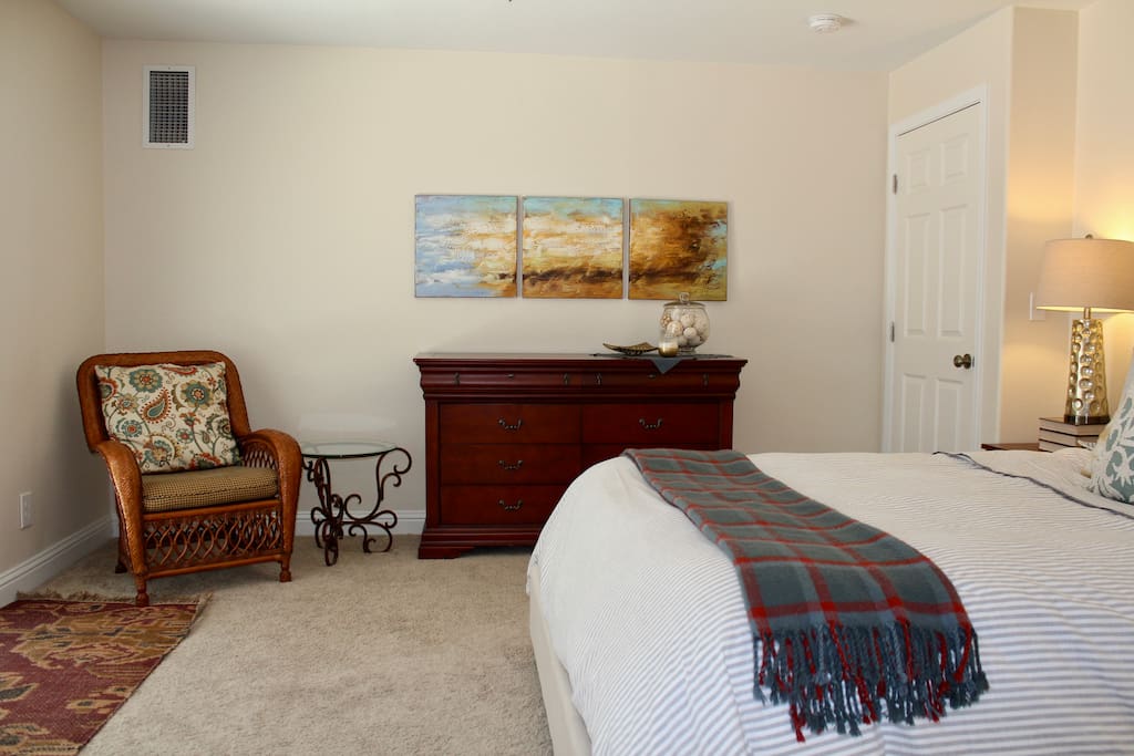 Your own private space for the night, with a dresser and a comfy chair to relax in.