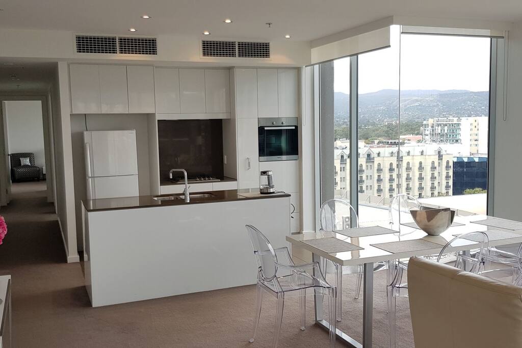 Sleek designer kitchen with full glass windows