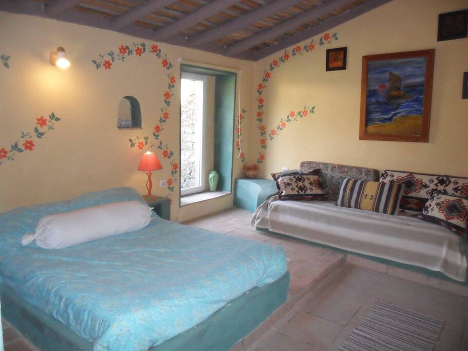 Room with double and single bed.