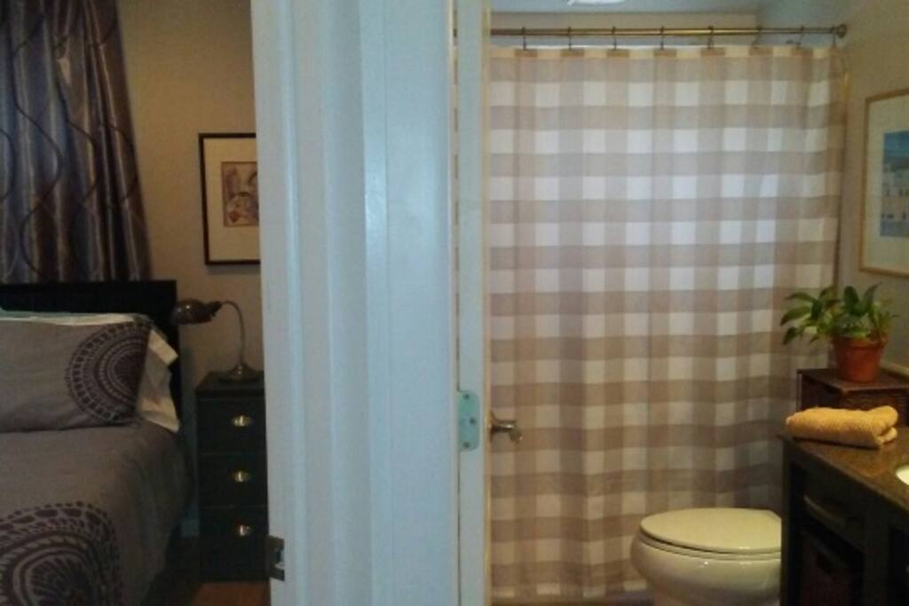 Bedroom and bath side by side.