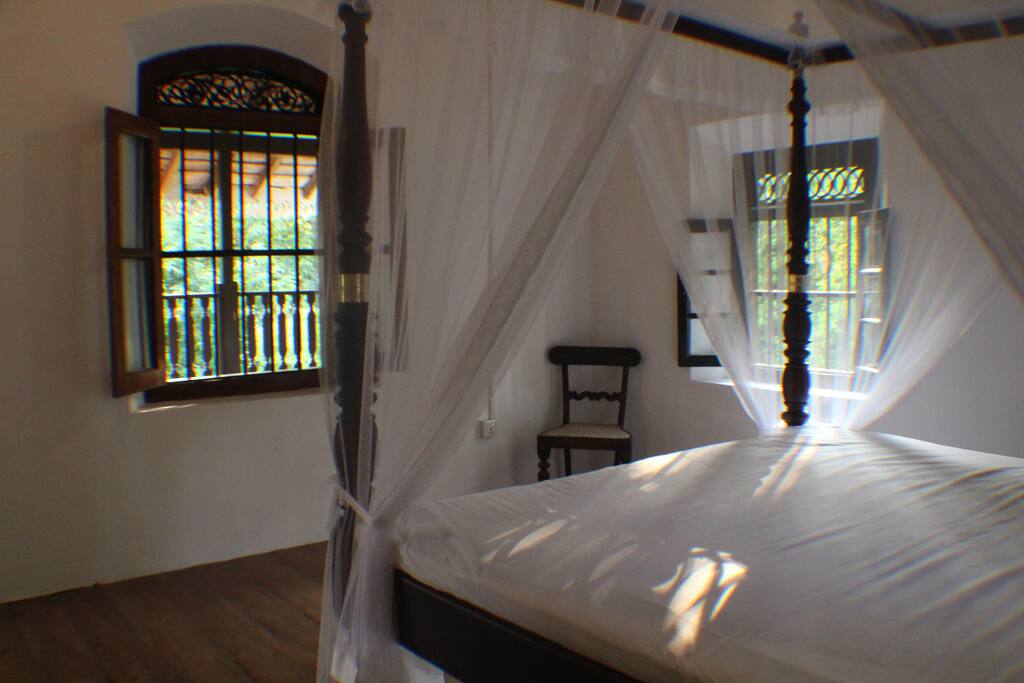 Looking out to the balcony from the bedroom