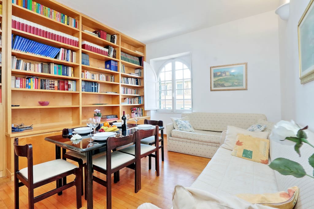 Rome Apartment at Colosseum - Living Room with table, chairs and sofa beds