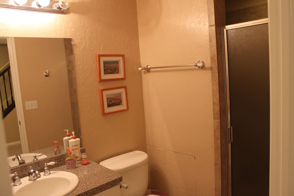 There is a washer and dryer in an adjoining storage area.
