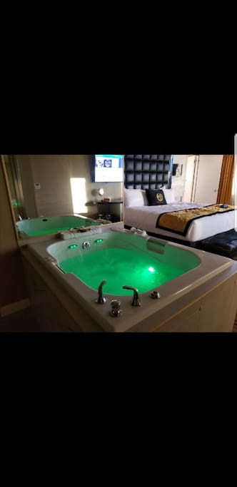 bedroom with Jacuzzi tub with lights