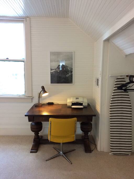 Hang your clothes in the closet, and set up your laptop on the vintage pedestal desk. Iron and ironing board are provided.