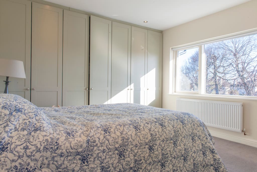 Bedroom with king bed overlooking the garden