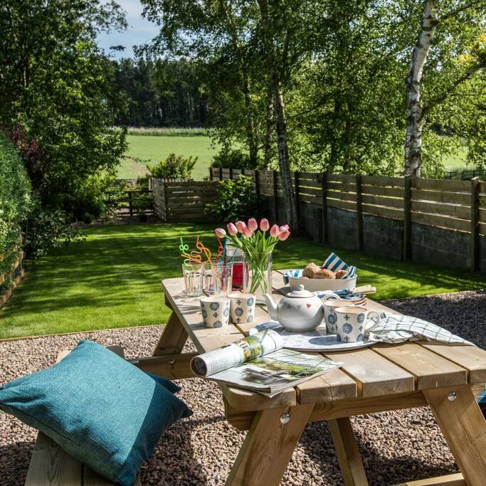 The beautiful and peaceful garden with an outside seating area