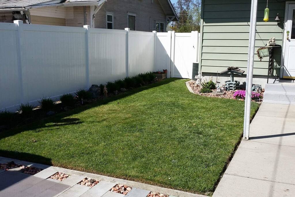 Enclosed backyard with firepit