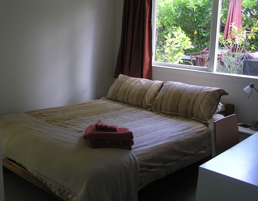Queen bed with desk and wardrobe