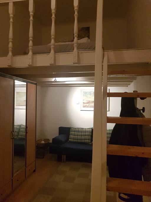 Bedroom, with stairs to upper level