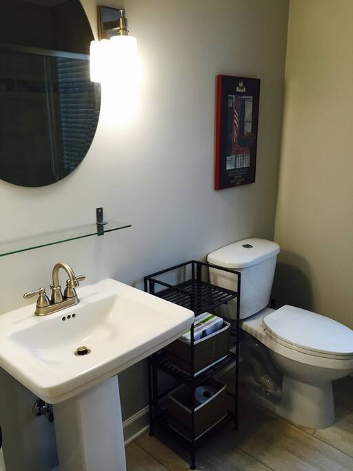 The bathroom has a tile floor and tile shower.