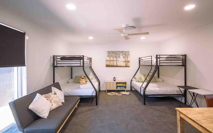 Large Retreat Room with study desk and sofa bed and air-con. 
Bunk beds are Doubles and Singles on top.