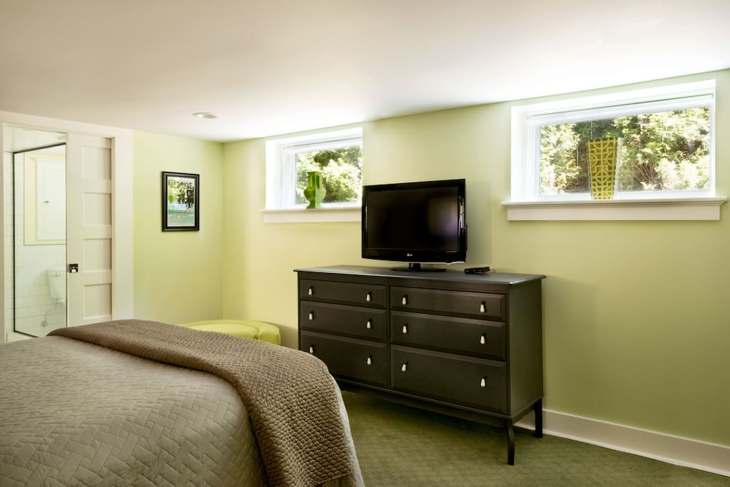 TV and large chest of drawers with sound bar HDTV