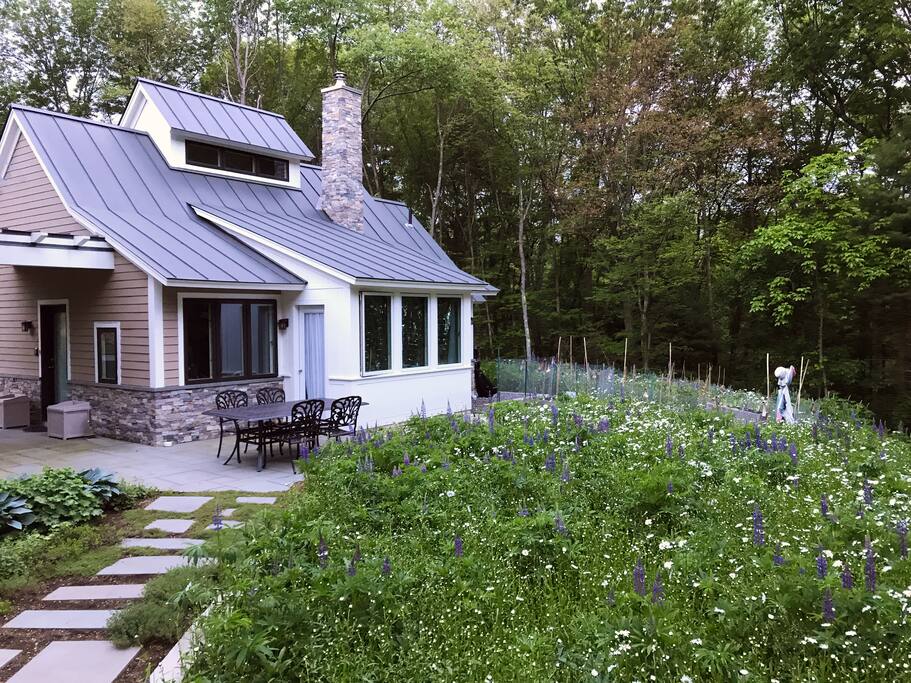 During the summer season, an extensive wildflower garden surrounds Hummingbird Cottage.