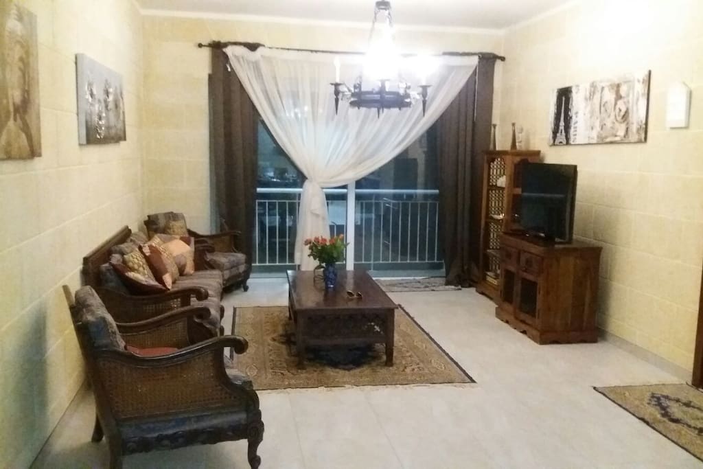 Living-room is very spacious and comfortable. With a nice long balcony, overlooking a sweet village street.