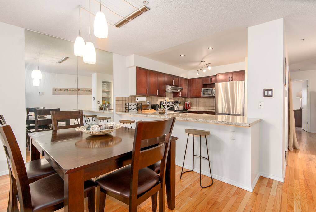 Breakfast bar, dining table and massive kitchen