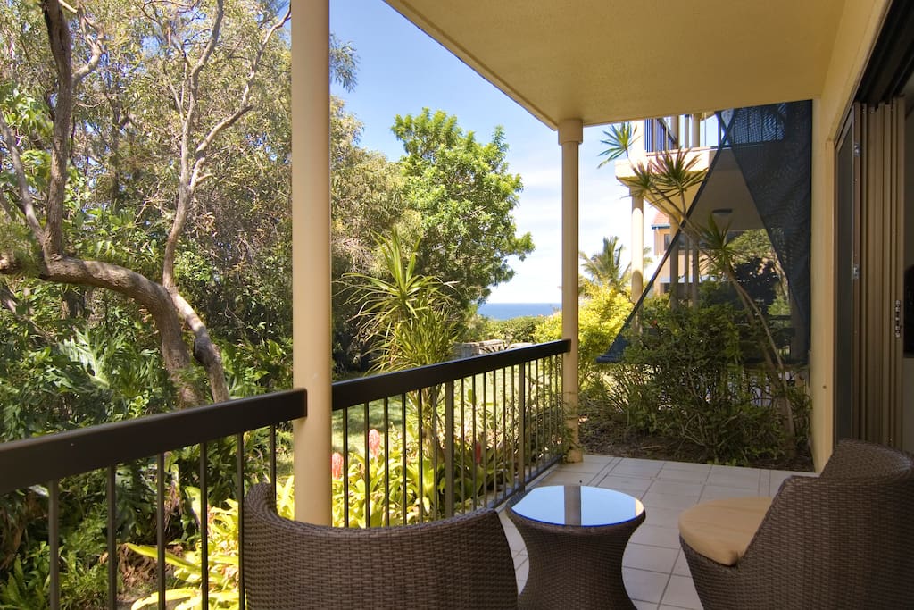 Peaceful garden setting with ocean glimpses