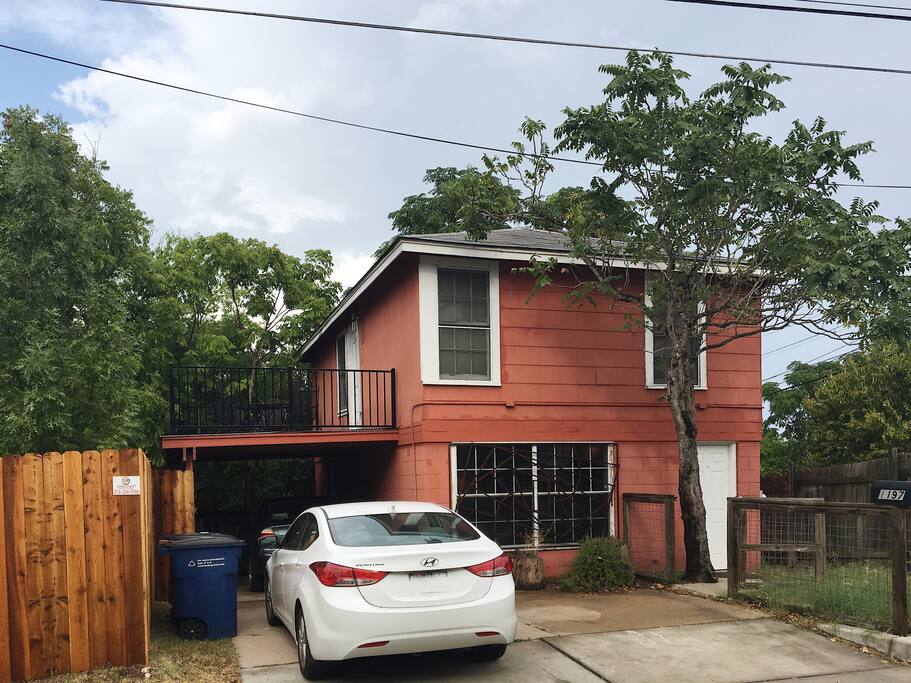 View of house from the street - brand new deck and fence!
