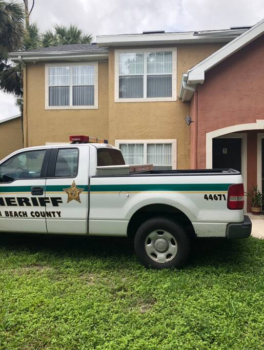 Neighbor Police parks his car outside our door
