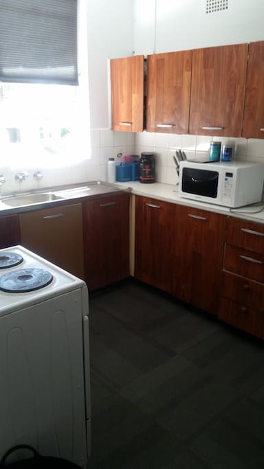 Kitchen has all necessary equipment for master chefs and microwave masters