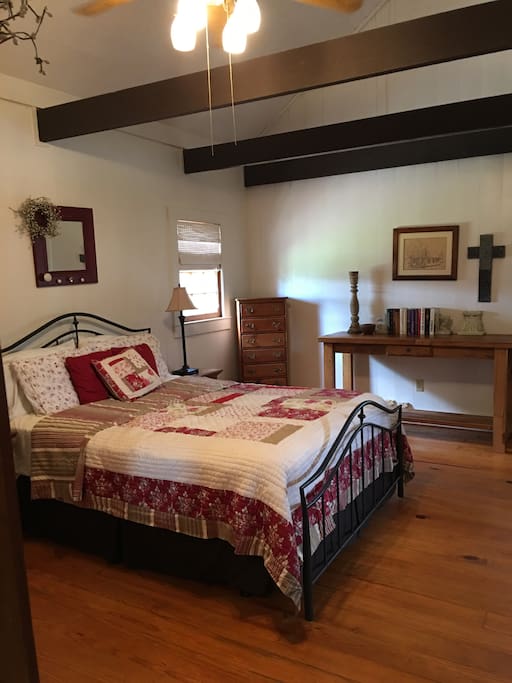 The. Downstairs Bedroom with a queen sized bed.
